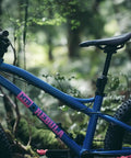 Youth Mountain Bike featuring Dropper Post 27.2mm External Routing with 90mm Travel for Kid Riders in a forest setting