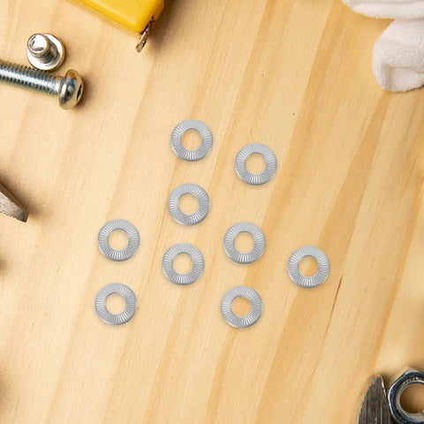 Tough As Nails M6 Conical Spring Washers 40 Pack 304 Stainless Steel arranged on wood surface for garage projects.