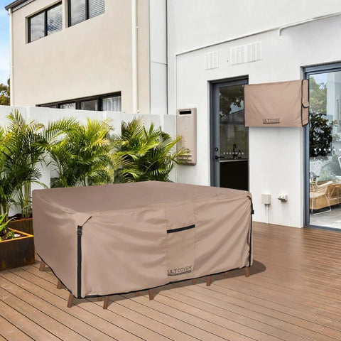 Heavy Duty Rectangular Patio Table Cover For 111 Inch Long By 74 Inch Wide Table With 6 To 8 Chairs, 600D Canvas Waterproof Outdoor Furniture Cover, All Weather Protection For Rain Sun And Dust on a patio.