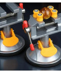 Super Durable Cast Iron Small Bench Vise With Suction Cup Flat Jaws And Precision Clamping Power For Hardwood Carving DIY Projects At Home Workshop Or Garage Table Use, showing suction base and clamping jaws.