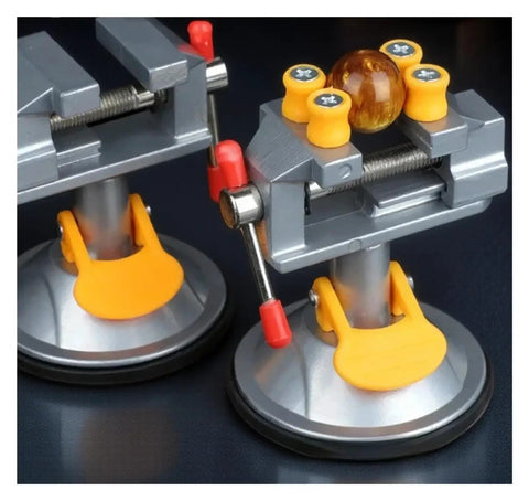 Super Durable Cast Iron Small Bench Vise With Suction Cup Flat Jaws And Precision Clamping Power For Hardwood Carving DIY Projects At Home Workshop Or Garage Table Use, showing suction base and clamping jaws.
