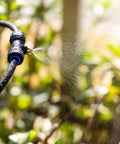 Outdoor Misting System With 26 Ft Tubing, 7 Brass Mist Nozzles And Three Quarter Inch Brass Adapter releasing fine mist