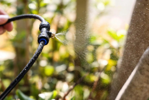 Outdoor Misting System With 26 Ft Tubing, 7 Brass Mist Nozzles And Three Quarter Inch Brass Adapter releasing fine mist