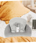 Portable Ergonomic Nap Pillow For Office And School, Face Down Sleep Cushion In Gray on bed with laptop and cup