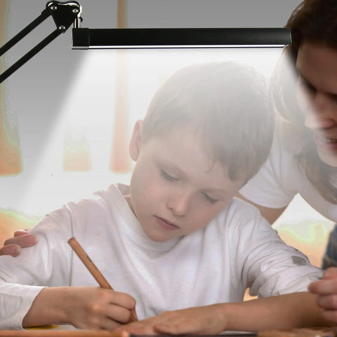 Child writing under Go To Metal Adjustable Swing Arm Desk Lamp With Clamp Touch Control Stepless Dimming And Three Color Modes Memory Function