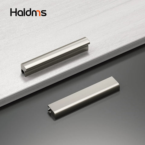 Two brushed nickel cabinet handles on a counter, part of a 10 Pack Adjustable Cabinet Handles In Brushed Nickel Square Satin Finish Drawer Pulls For Kitchen Cabinets Adjustable Hole Centers From 1 Inch To 4 Inches Center To Center From 25 Millimeters To 102 Millimeters Overall Length 4.41 Inches set.