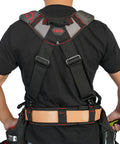 Man wearing adjustable red gel padded tool belt suspenders for construction with breathable shoulder straps, rear view.