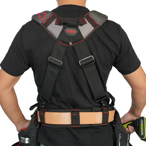 Man wearing adjustable red gel padded tool belt suspenders for construction with breathable shoulder straps, rear view.