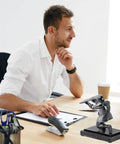 Businessman using computer with Knight Pen Holder With Two Pens And Resin Desk Organizer For Men Funny Executive Pen Stand on desk