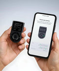 Secure Your Crypto Stash With This Top Shelf Biometric Hardware Wallet featuring a user holding the device and smartphone for transaction verification.