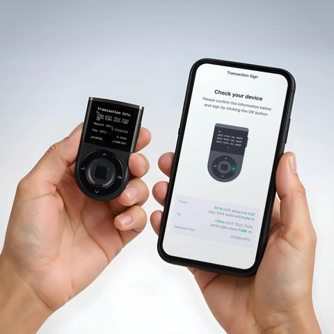 Secure Your Crypto Stash With This Top Shelf Biometric Hardware Wallet featuring a user holding the device and smartphone for transaction verification.