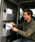 Man organizing documents in Tough As Nails Aluminum Van Storage Rack Wall Mount Organizer 30.5x3.5x18 Cm in van