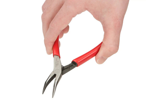Hand holding Super Handy Mini Forty Five Degree Long Nose Pliers Built To Reach Around Obstructions with red grips and bent tip