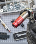 Hand holding Pocket Size Precision Torque Driver With Mini Indexed Wrench And Variable Torque Control Works With Quarter Inch And Twelve Millimeter Sockets close-up