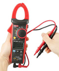 Person holding 600A True RMS Digital Clamp Meter Multimeter With Auto Range Data Hold And Frequency Measurement, Overload Protection