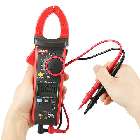 Person holding 600A True RMS Digital Clamp Meter Multimeter With Auto Range Data Hold And Frequency Measurement, Overload Protection