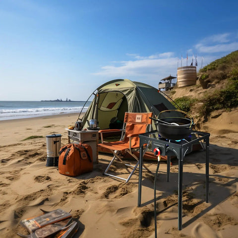 30000 BTU Propane Outdoor Stove With Adjustable Height Single Burner Heavy Duty Cooker set up on sandy beach with camping gear