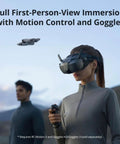 Person using Neo Mini Drone With 4K UHD Camera Dope Lightweight 135g Self Flying with FPV goggles outdoors.