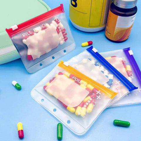 Waterproof Pill Organizer Set With 14 Color Coded Pouches Twice Daily Large Pill Holder For Seven Days on blue background