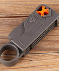 Coaxial Cable Stripping And Crimping Tool With Adjustable Two Blade Knife, Compatible With 4 5 6 And 7 Coax Cables on wood surface.