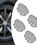 Heavy Duty Abs Wheel Center Caps 4 Pack Rust Proof Snap In Hub Covers Universal 2.12 Inch Silver Finish next to a car wheel.