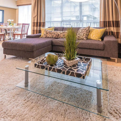 24 Inch Square Glass Table Top 1/4 Inch Thick Tempered Replacement Glass With Flat Polished Edge And Eased Corners For Coffee Dining Patio Tables Crystal Clear Surface And Furniture Protection on a modern coffee table in a cozy living room.
