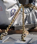 Binder Chain With Clevis Grab Hooks Grade 70 5 16 Inch 20 Foot Heavy Duty Tie Down securing load on flatbed truck