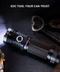 Beast Mode 3500 Lumen USB C Rechargeable Flashlight for Camping and Hiking on table with watch and keys