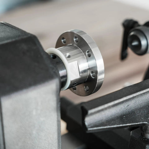Close-up of Heavy Duty 1x8Tpi Face Plate Kit For Woodturning Lathes, featuring steel plate and nylon washer on lathe.