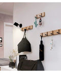 Wall Mounted Nailless Folding Coat Hook Set Featuring Twin Bar Design for Hallway Closet Entryway, wood hooks holding bags and keys.