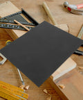 Premium Fine Grit Sandpaper Sheets For Precision Sanding On Wood Metal Plastic and Crafts Durable Carborundum Finish on workbench.