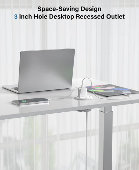 3 Inch Recessed Desk Power Grommet With USB C 65W Fast Charging and Ultra Flat Plug Strip in use on a desk with laptop and phone.