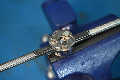 Adjustable Self Centering Die Stock for 1 Inch Dies, Heavy Duty Metalworking Tool on a blue vise, close-up view