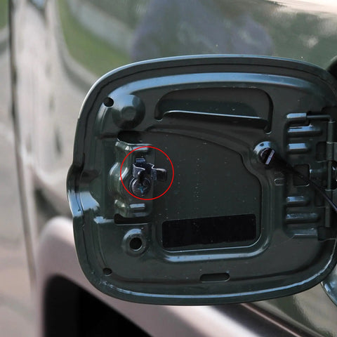 Close-up of the Fuel Door Hinge Spring Replacement For Toyota 4Runner Tacoma Tundra FJ Cruiser Sequoia an upgraded latch.