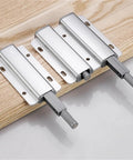 Magnetic Cabinet Latches For Touch Open Cabinets, No Fuss Handle Free Aluminum Alloy Door Catches on wooden surface