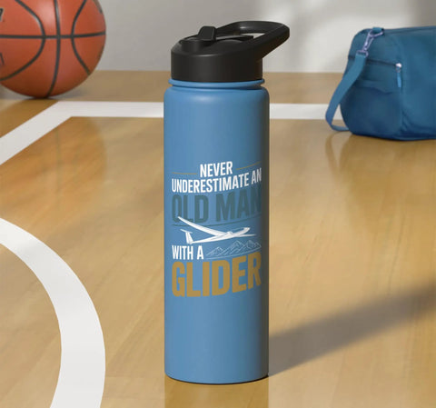 Blue stainless steel insulated bottle with "Never underestimate an old man with a glider" text, on a basketball court.
