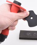 Hand holding Pro Grade Leather Punch Set with 13 Hollow Punch Heads for Clean Holes and Gaskets, showcasing punch shaft and ABS case