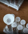 Premium Coffee Bean Storage Tubes With Display Stand And One Way Valve To Keep Your Daily Grind Sealed Tight And Locks In Maximum Freshness For Every Bold Morning Cup You Crave with glass tubes and funnel.