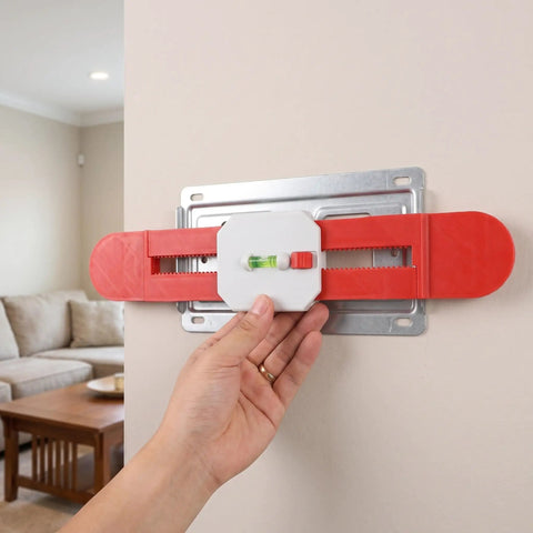 Retractable Spirit Level Tool for Air Conditioner Mounting Bracket held against a wall for precise installation.