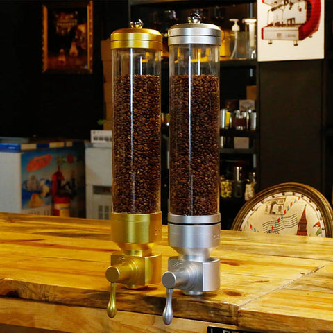 Wall Mounted Transparent Coffee Canister With Gold Trim And Smooth Grip Handle Straight Up Fantastic Dry Food Dispenser For Sugar Rice Nuts Cereals Pet Treats Zero Stress Counter Organizer To Keep Your Pantry Legit with coffee beans.