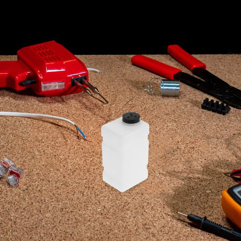 Workshop table with Clear 120CC RC Plane Fuel Tank Set With Metal Tubing And Engine Container in center.
