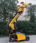 Rock Solid Heavy Duty Vacuum Lifter For Smooth Glass Panel Mounting And Stone Handling No Sweat Metal Sheet Moving Tool Industrial Suction Grip For Any Tough Job On The Building Site, featuring a yellow and blue multi-angle grip design.
