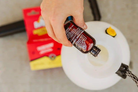 Indoor Outdoor Bug Killer Concentrate Makes 2 Gallons From 2 Oz Liquid poured into sprayer for pest control