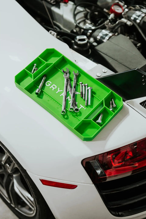 Non Slip Silicone Tool Tray for Mechanics and DIYers Small Grip Mat with tools on car hood, green, flexible high heat resistant organizer