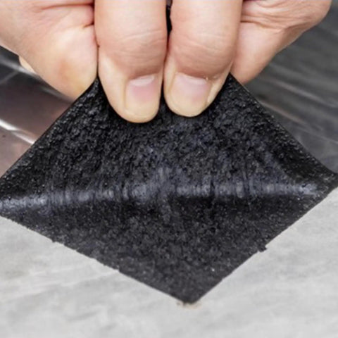 Heavy Duty Asphalt Roofing Tape That Kicks Leaks To The Curb With Heat Reflective Aluminum Foil Flashing Roll waterproof sealant being applied.
