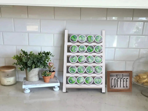 Wood K Cup Holder For Countertop And Kitchen, Farmhouse Decor with coffee pods displayed next to planters and a farmhouse sign.