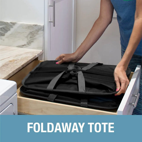 Person placing collapsible laundry caddy 2 pack 64L cream charcoal foldable laundry basket in drawer for storage.