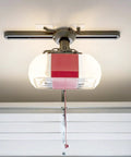 Rough Service 100W LED Light Bulb for Garage, Shop, and Ceiling Fans, installed in a garage ceiling fixture, instant brightness