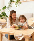 12 Pack Clear Corner Protectors Baby Proof Furniture Edge Bumpers on wooden table protecting toddler during reading time.
