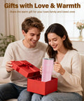 Couple smiling while unboxing a Self Heating Coffee Mug 20oz Electric Temp Control Warmer in a gift box.